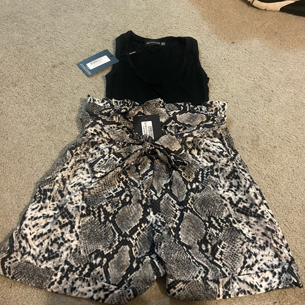 Grey snake print high waisted shorts with black tank top both size M